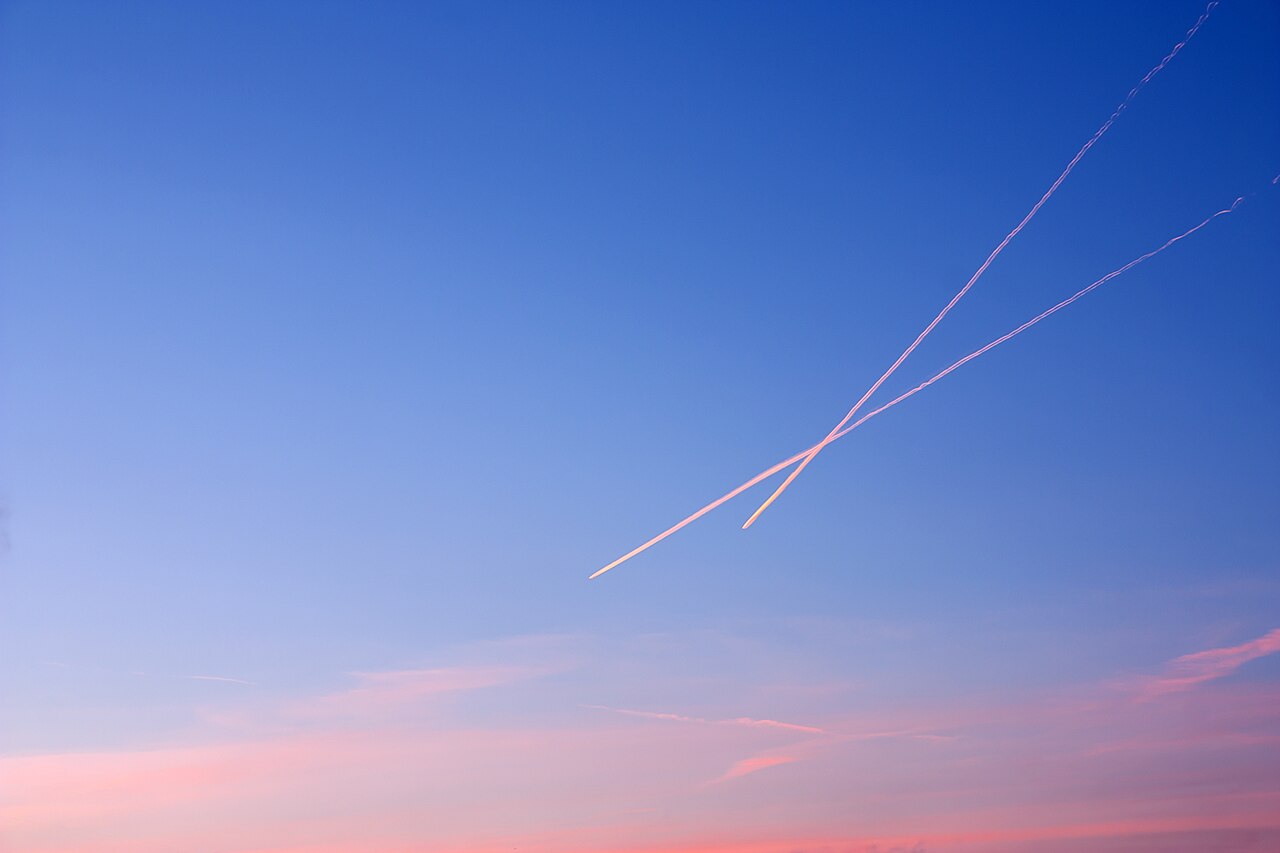 Contrails in the sky at sunset.jpg